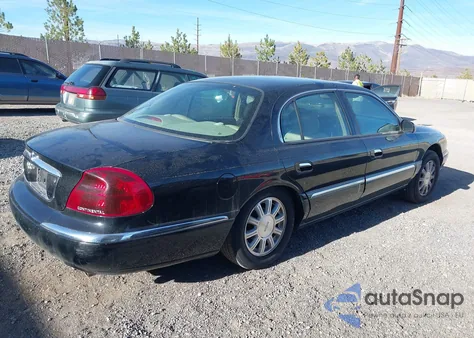 2002 Lincoln Continental z USA, uszkodzony, nr VIN 1LNHM97V12Y614570